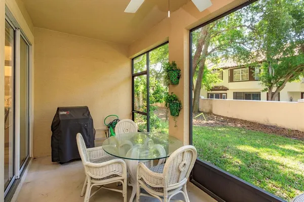 a dining room with furniture and garden view
