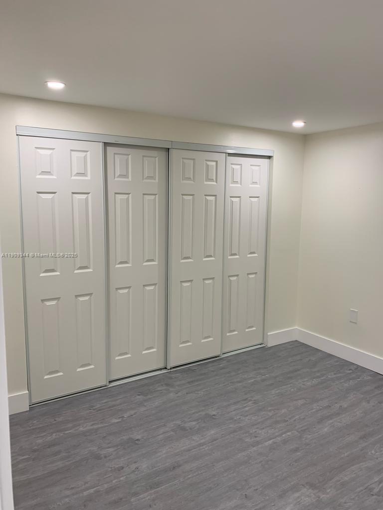1555 West 44th Place, Unit 234 Hialeah, FL 33012 - Photo 13 of 38 wooden floor in an empty room