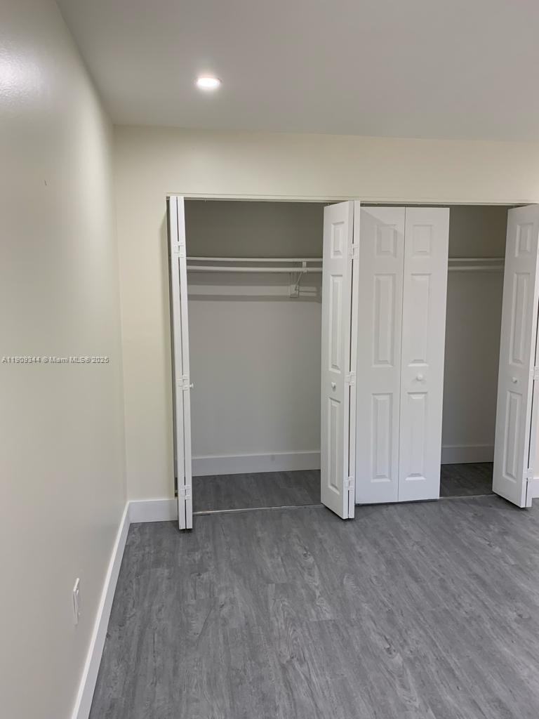 1555 West 44th Place, Unit 234 Hialeah, FL 33012 - Photo 18 of 38 an empty room with closet area