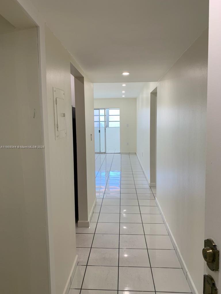 1555 West 44th Place, Unit 234 Hialeah, FL 33012 - Photo 24 of 38 a view of a hallway