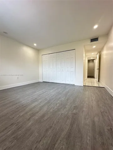 a view of empty room with windows