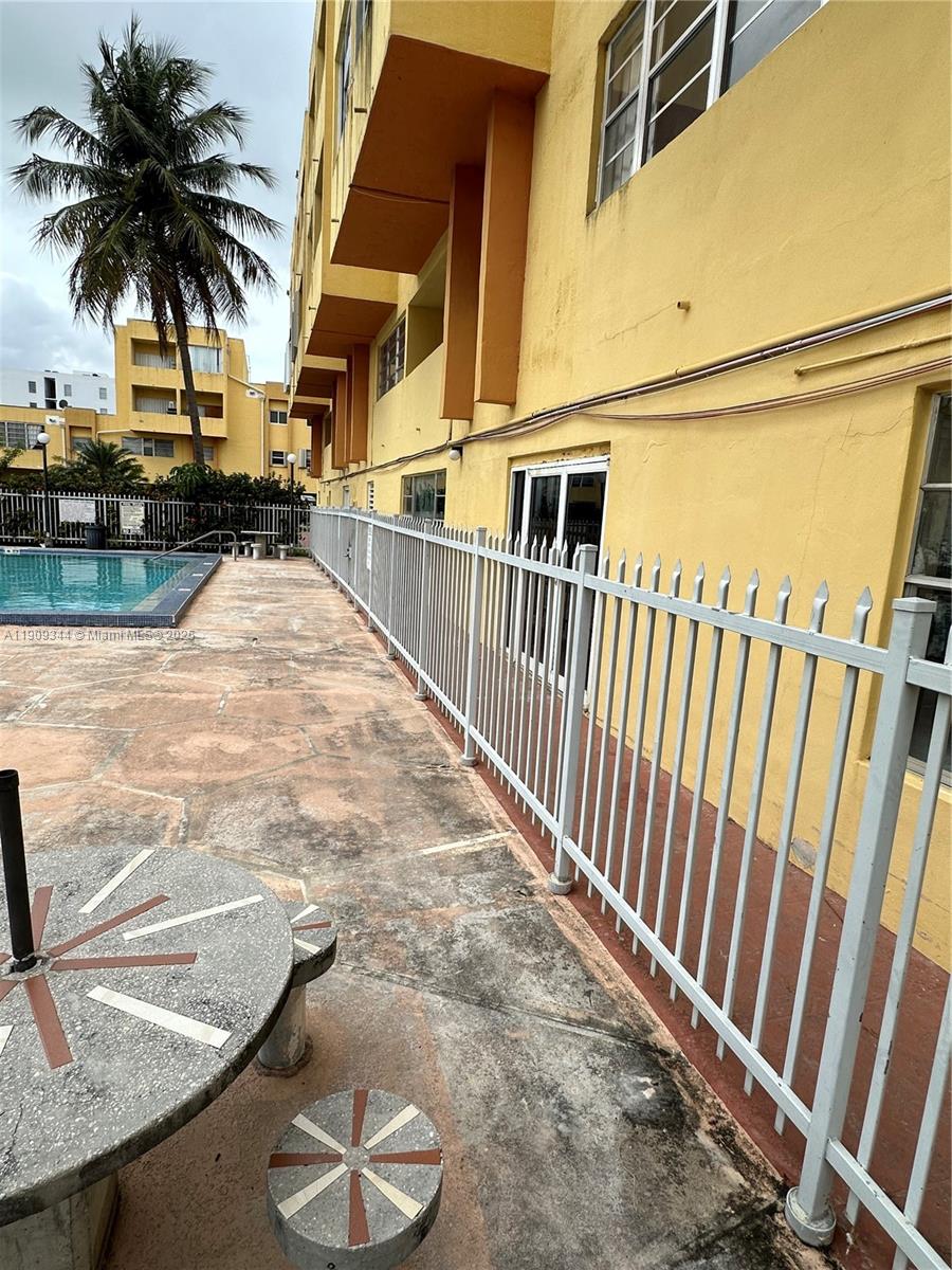 1555 West 44th Place, Unit 234 Hialeah, FL 33012 - Photo 37 of 38 a view of outdoor space and deck