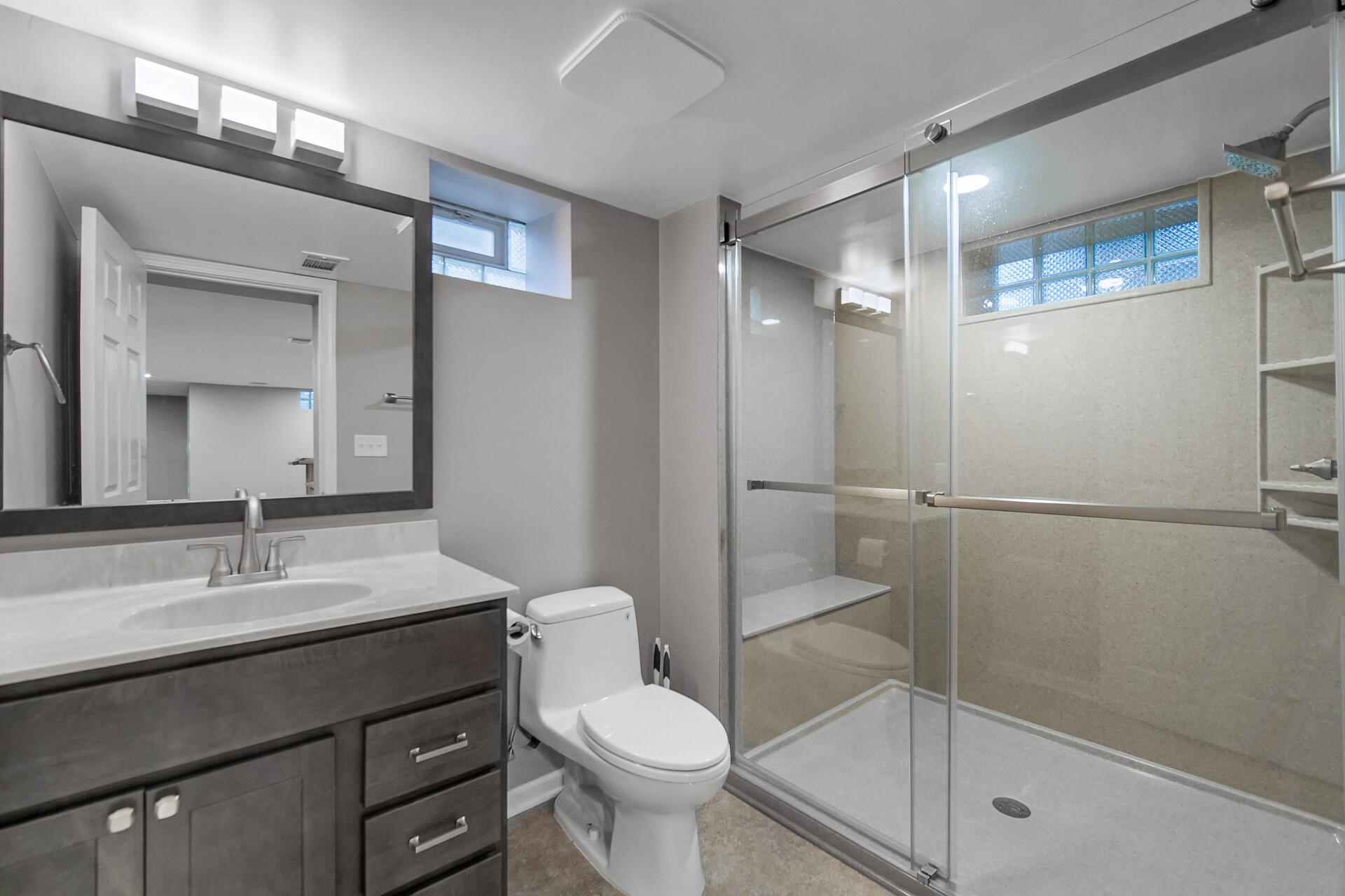 8342 Howard Avenue Munster, IN 46321 - Photo 22 of 31 a bathroom with a sink toilet and shower