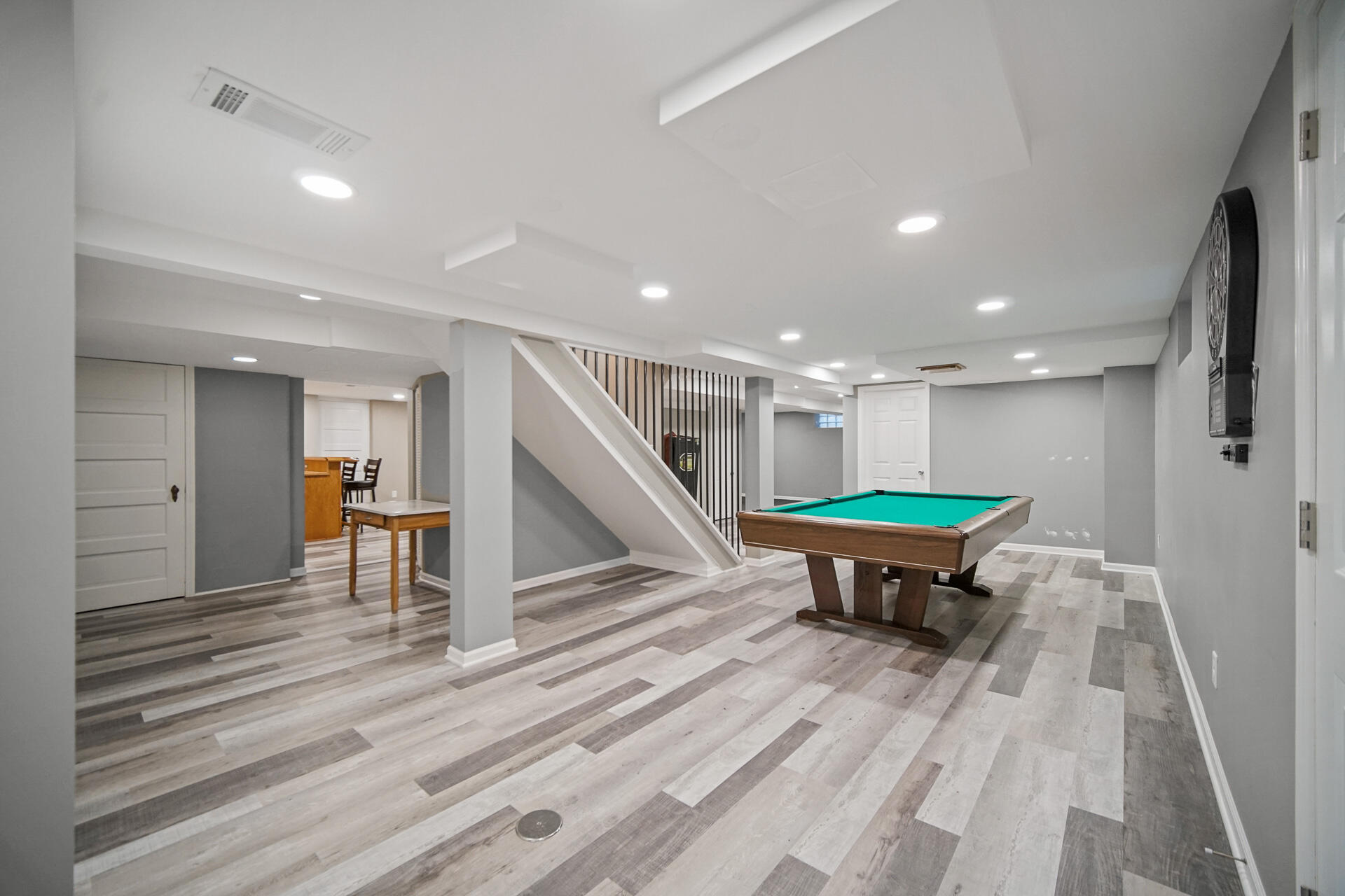 8342 Howard Avenue Munster, IN 46321 - Photo 23 of 31 a room with wooden floor and pool table