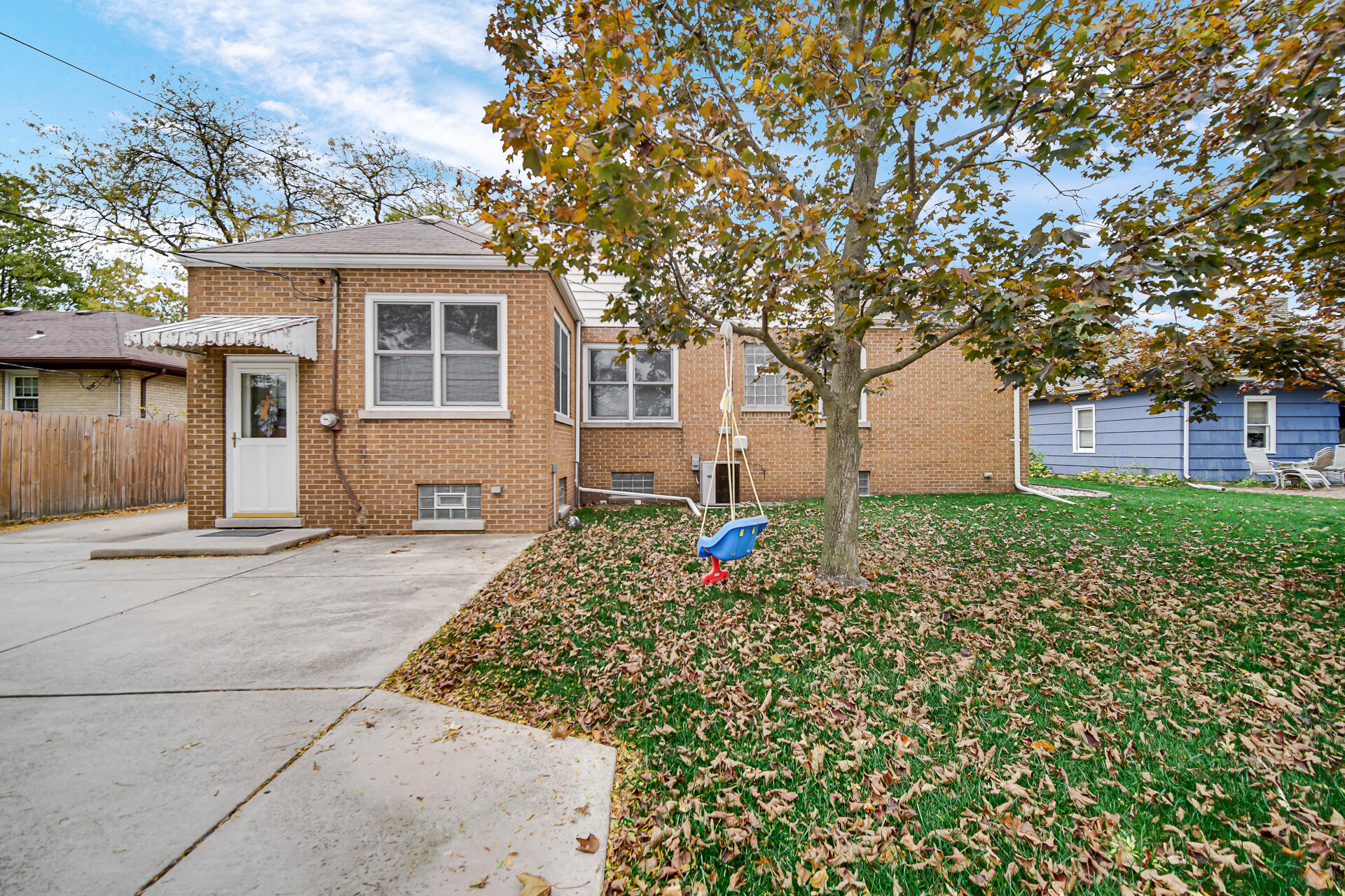 8342 Howard Avenue Munster, IN 46321 - Photo 28 of 31 front view of a house with a bench