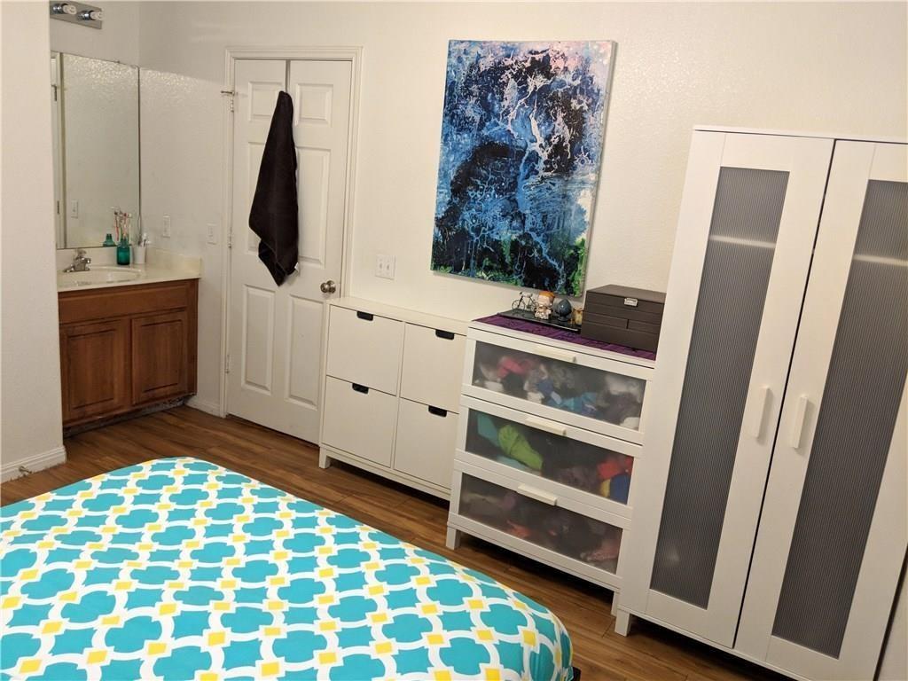 5501 Duval Street, Unit B Austin, TX 78751 - Photo 8 of 12 a bedroom with a bed and a bathroom view