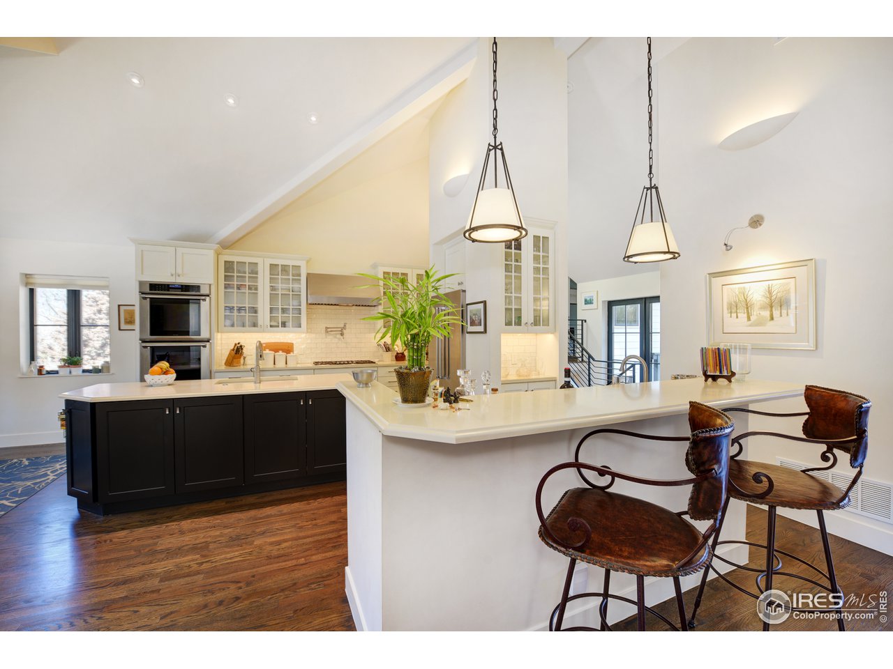 742 8th Street Boulder, CO 80302 - Photo 12 of 37 a living room with furniture and a kitchen view