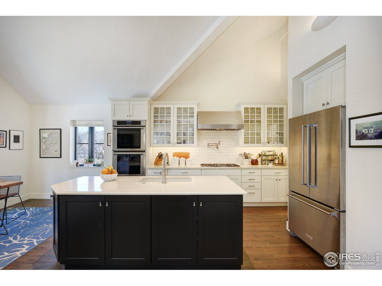 742 8th Street Boulder, CO 80302 - Photo 13 of 37 a kitchen with a refrigerator and a sink