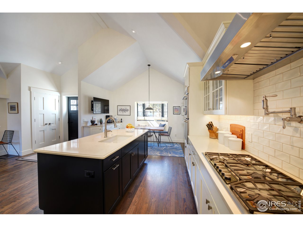 742 8th Street Boulder, CO 80302 - Photo 14 of 37 a large kitchen with a counter space a sink stainless steel appliances and cabinets