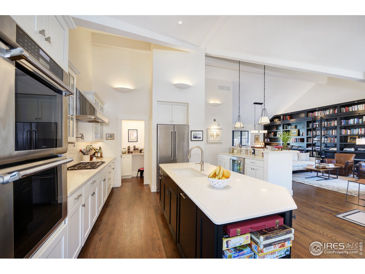 742 8th Street Boulder, CO 80302 - Photo 16 of 37 a kitchen with kitchen island a stove a sink and a refrigerator