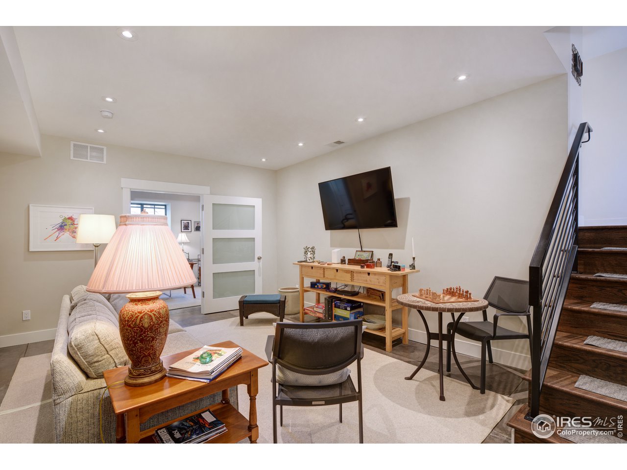 742 8th Street Boulder, CO 80302 - Photo 25 of 37 a living room with furniture and a flat screen tv