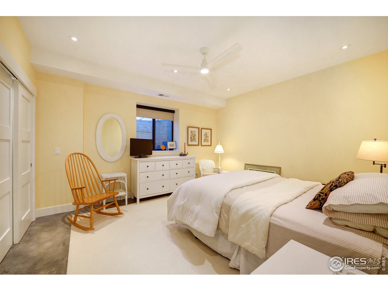 742 8th Street Boulder, CO 80302 - Photo 26 of 37 a bedroom with a bed a table and chair