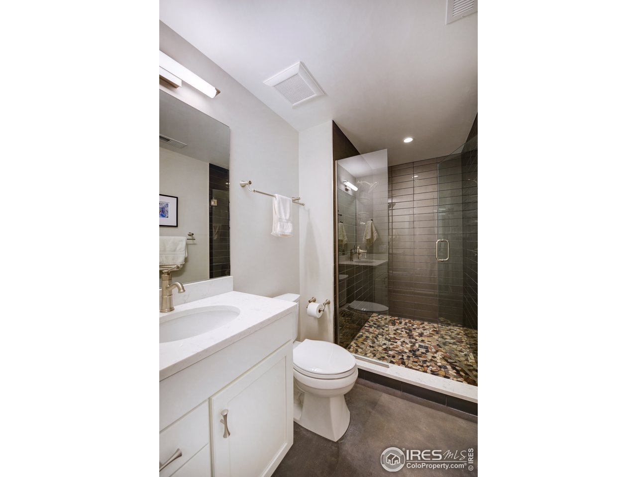 742 8th Street Boulder, CO 80302 - Photo 28 of 37 a bathroom with a sink a toilet and shower