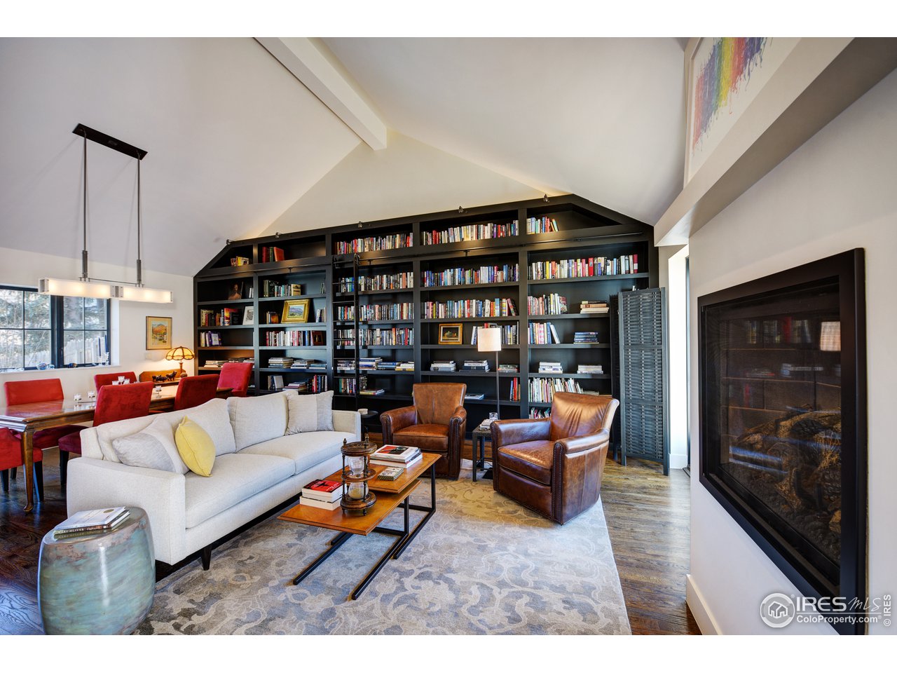 742 8th Street Boulder, CO 80302 - Photo 5 of 37 a living room with furniture and a book shelf