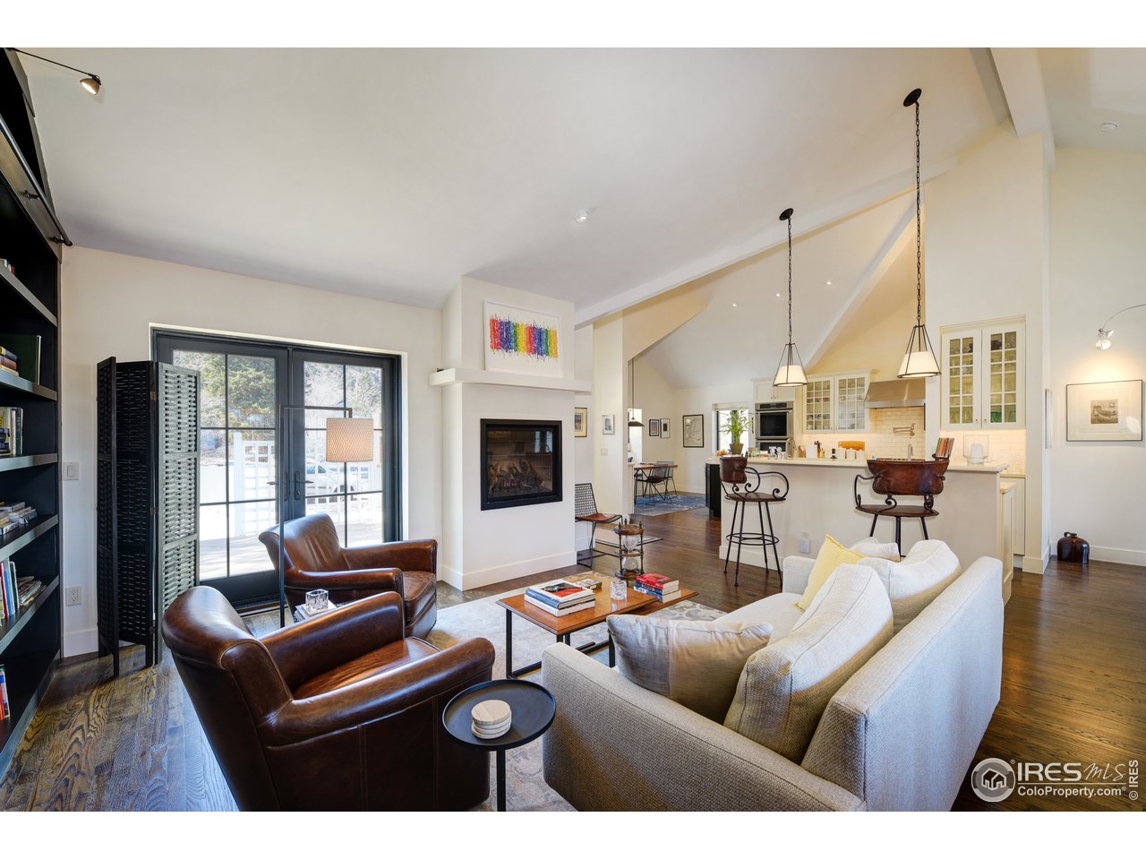 742 8th Street Boulder, CO 80302 - Photo 6 of 37 a living room with furniture a flat screen tv and a large window