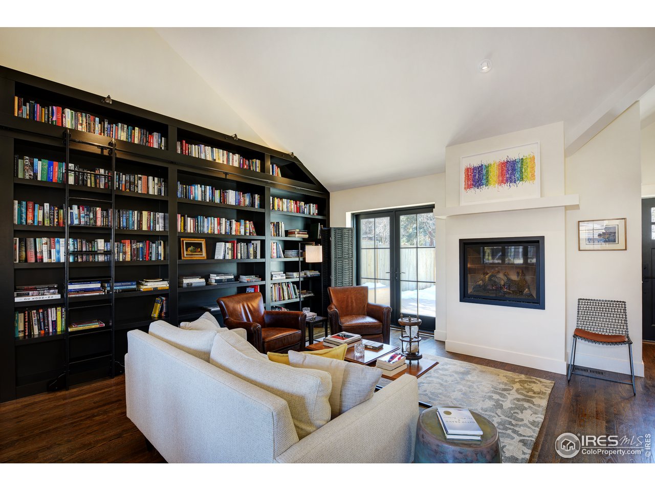 742 8th Street Boulder, CO 80302 - Photo 7 of 37 a living room with furniture and a flat screen tv