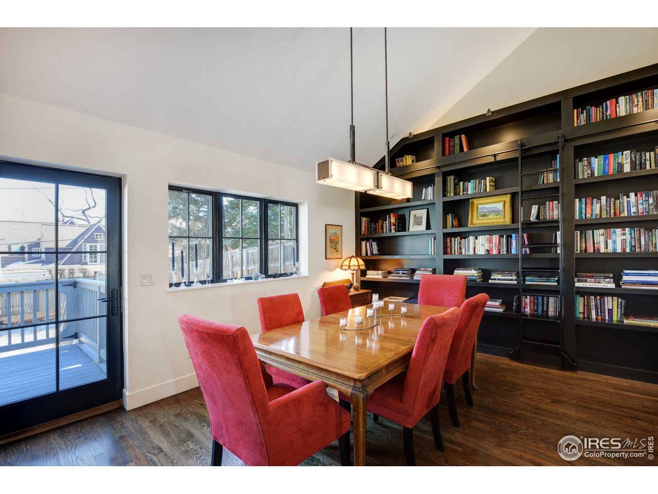 742 8th Street Boulder, CO 80302 - Photo 8 of 37 a view of a dining room with furniture and a book shelf