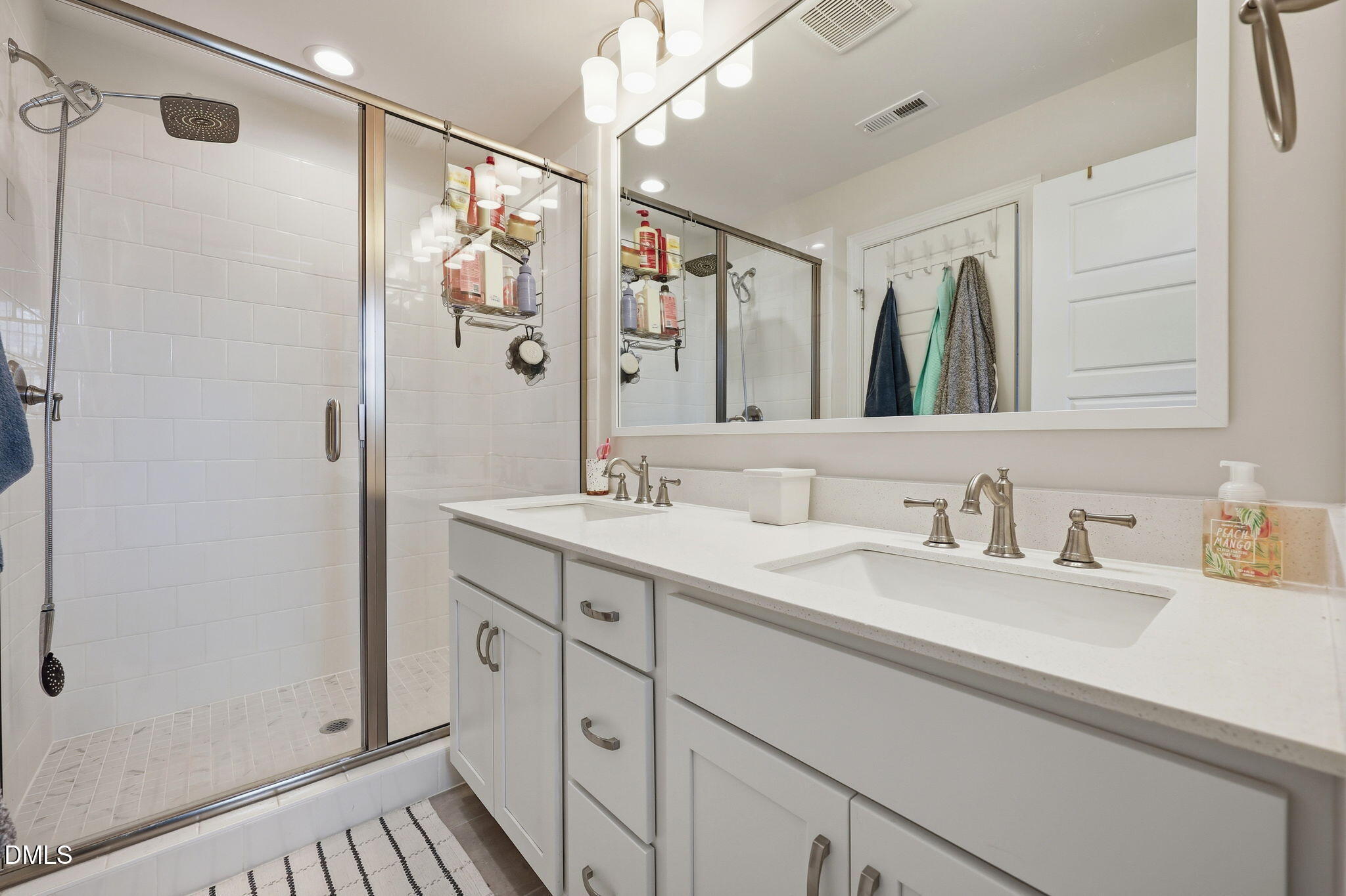 104 Kavanaugh Road Wake Forest, NC 27587 - Photo 19 of 36 a bathroom with a double vanity sink mirror and shower