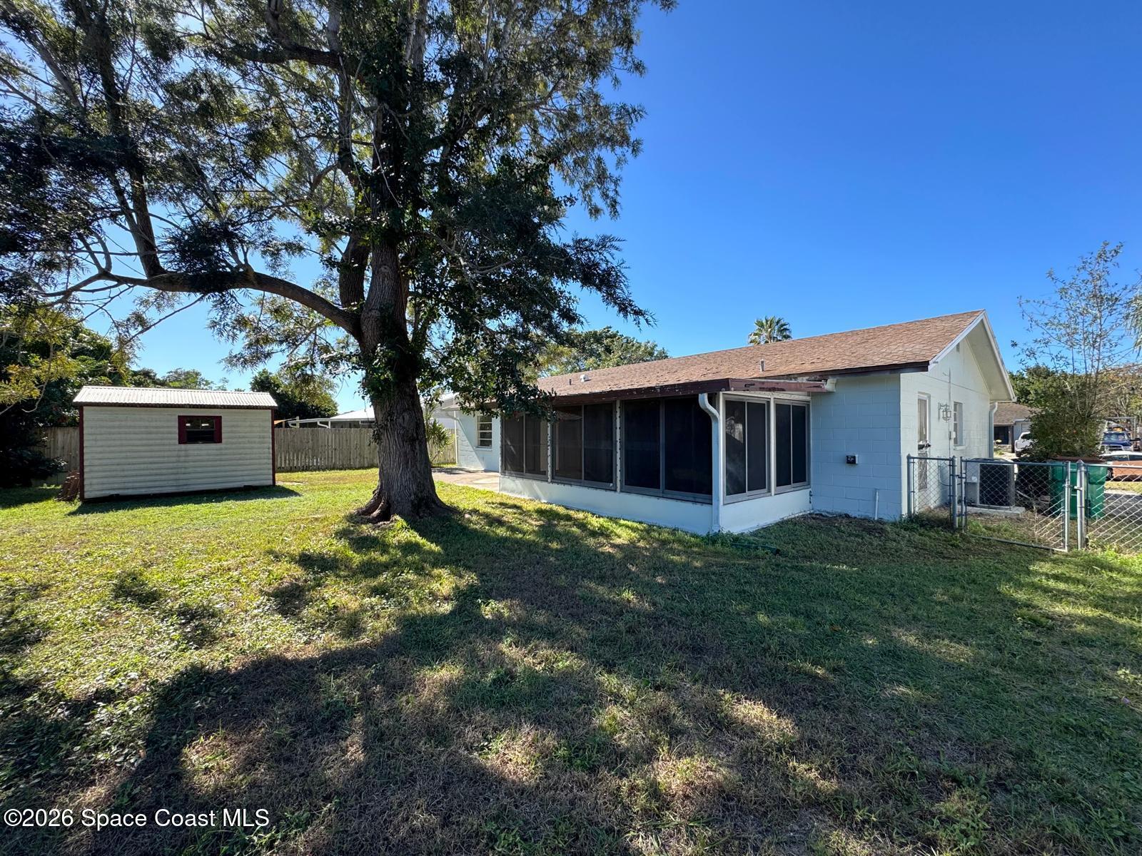 518 Sylvia Road Melbourne, FL 32904 - Photo 12 of 18 a view of a house with a yard