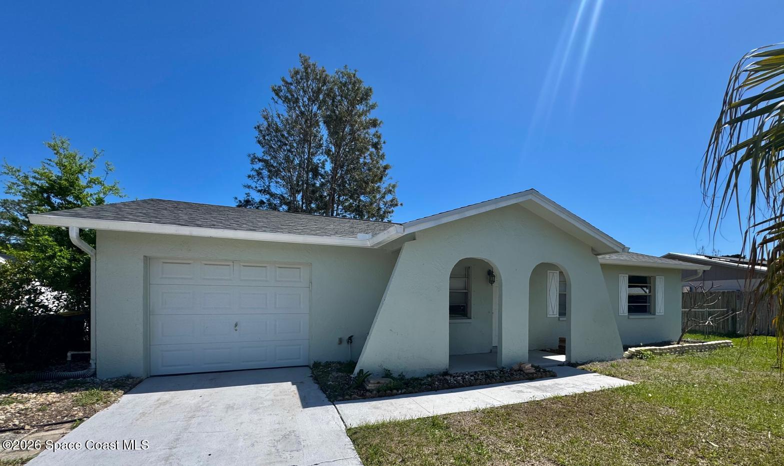 518 Sylvia Road Melbourne, FL 32904 - Photo 18 of 18 a view of a house with a yard