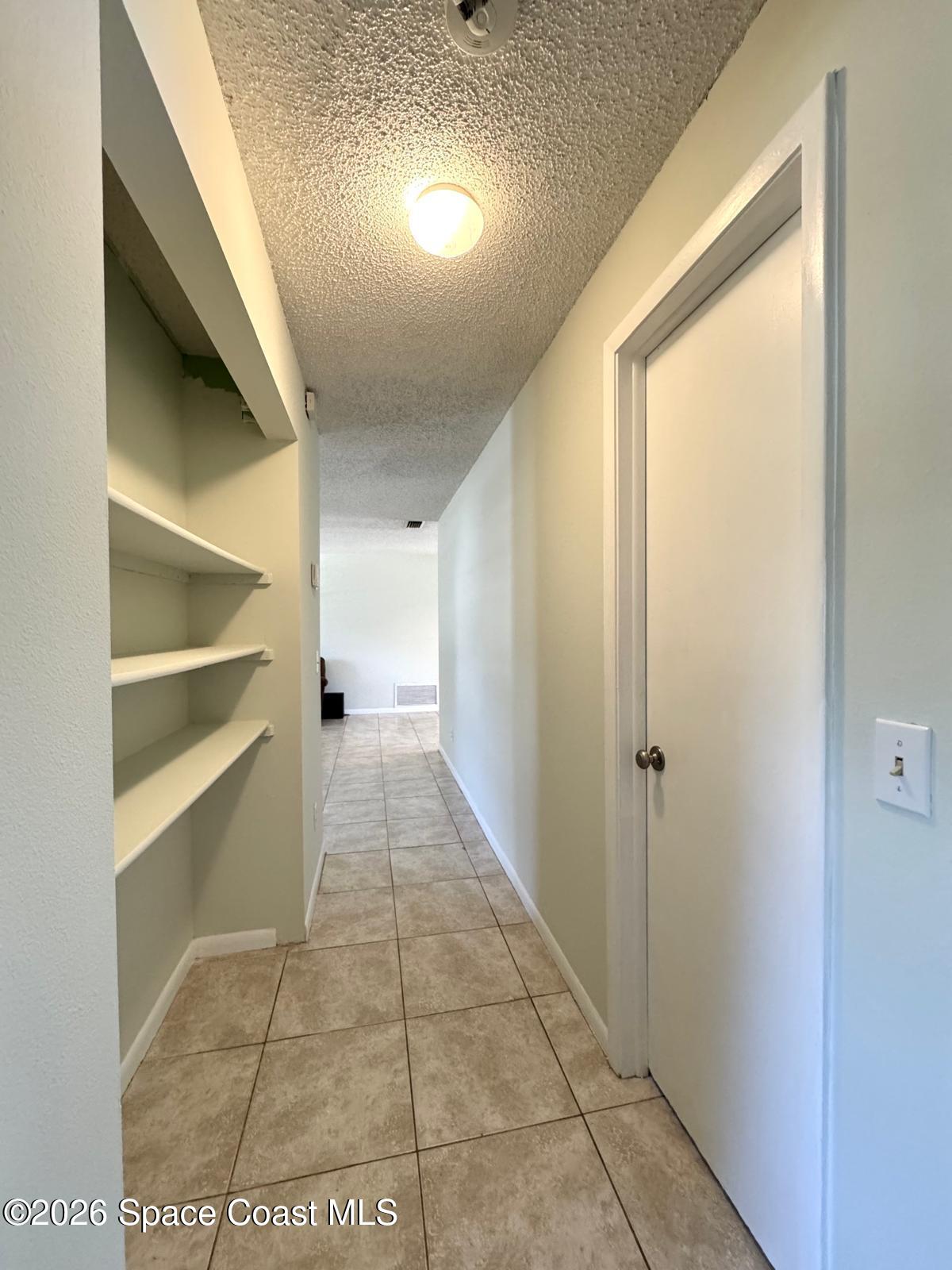 518 Sylvia Road Melbourne, FL 32904 - Photo 7 of 18 a view of entryway with a window and stairs