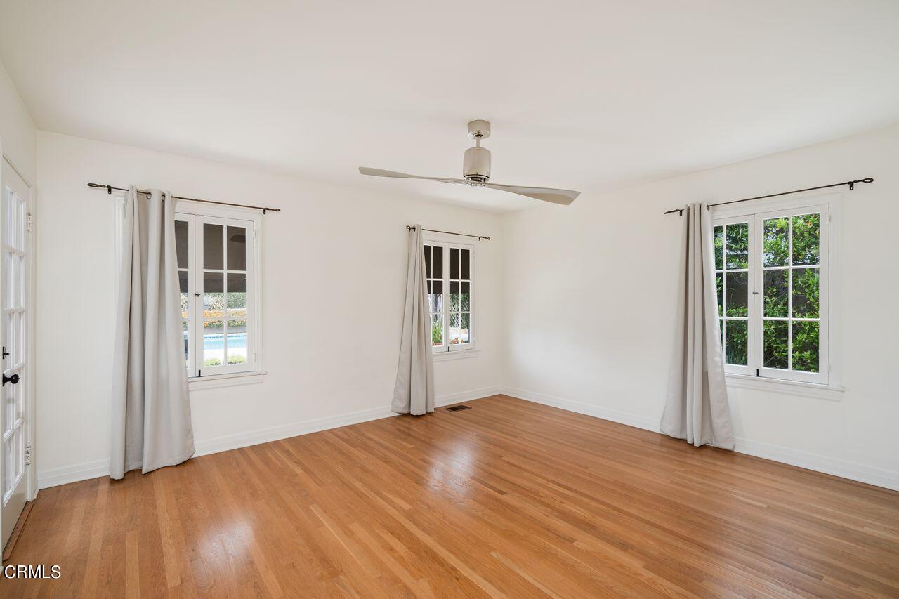 2107 Minoru Drive Altadena, CA 91001 - Photo 13 of 29 a view of an empty room with window and wooden floor