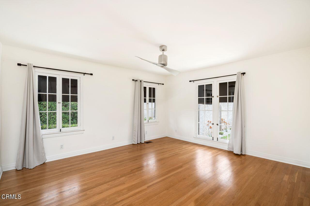 2107 Minoru Drive Altadena, CA 91001 - Photo 15 of 29 a view of an empty room with wooden floor and a window