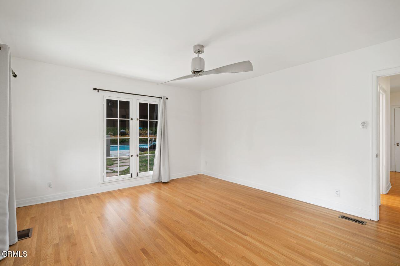 2107 Minoru Drive Altadena, CA 91001 - Photo 17 of 29 an empty room with wooden floor and windows