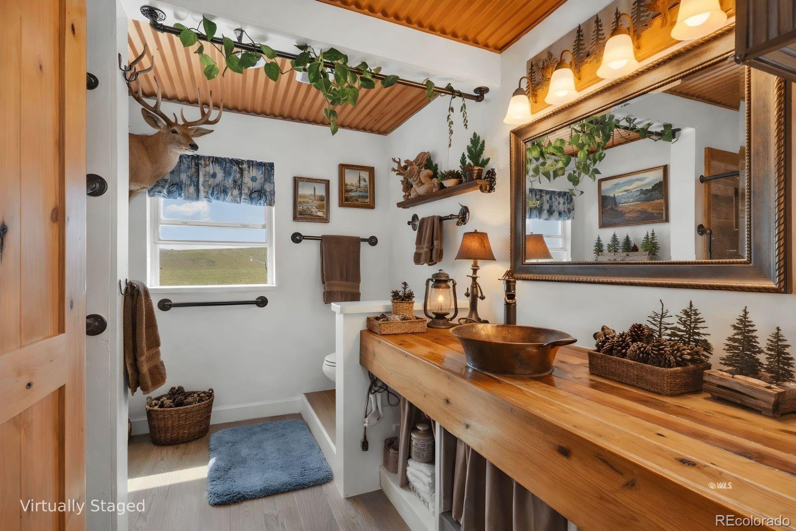 535 Brittany Road Westcliffe, CO 81252 - Photo 16 of 31 a kitchen with a sink and a stove next to a window
