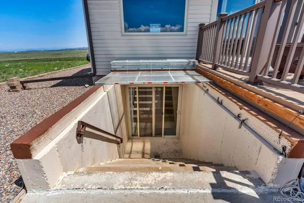 a view of a backyard with a sitting area