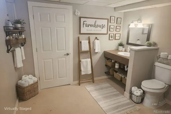 a view of a balcony with chair and wooden floor
