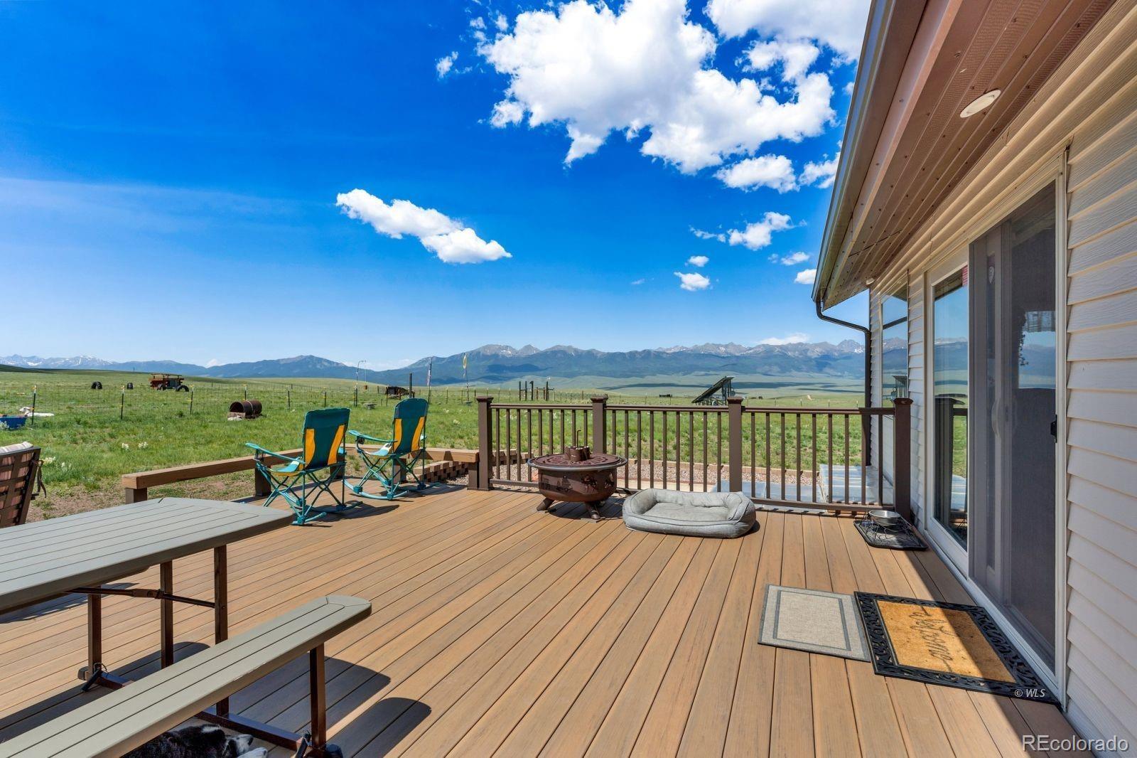 535 Brittany Road Westcliffe, CO 81252 - Photo 25 of 31 a view of a balcony with chair and wooden floor