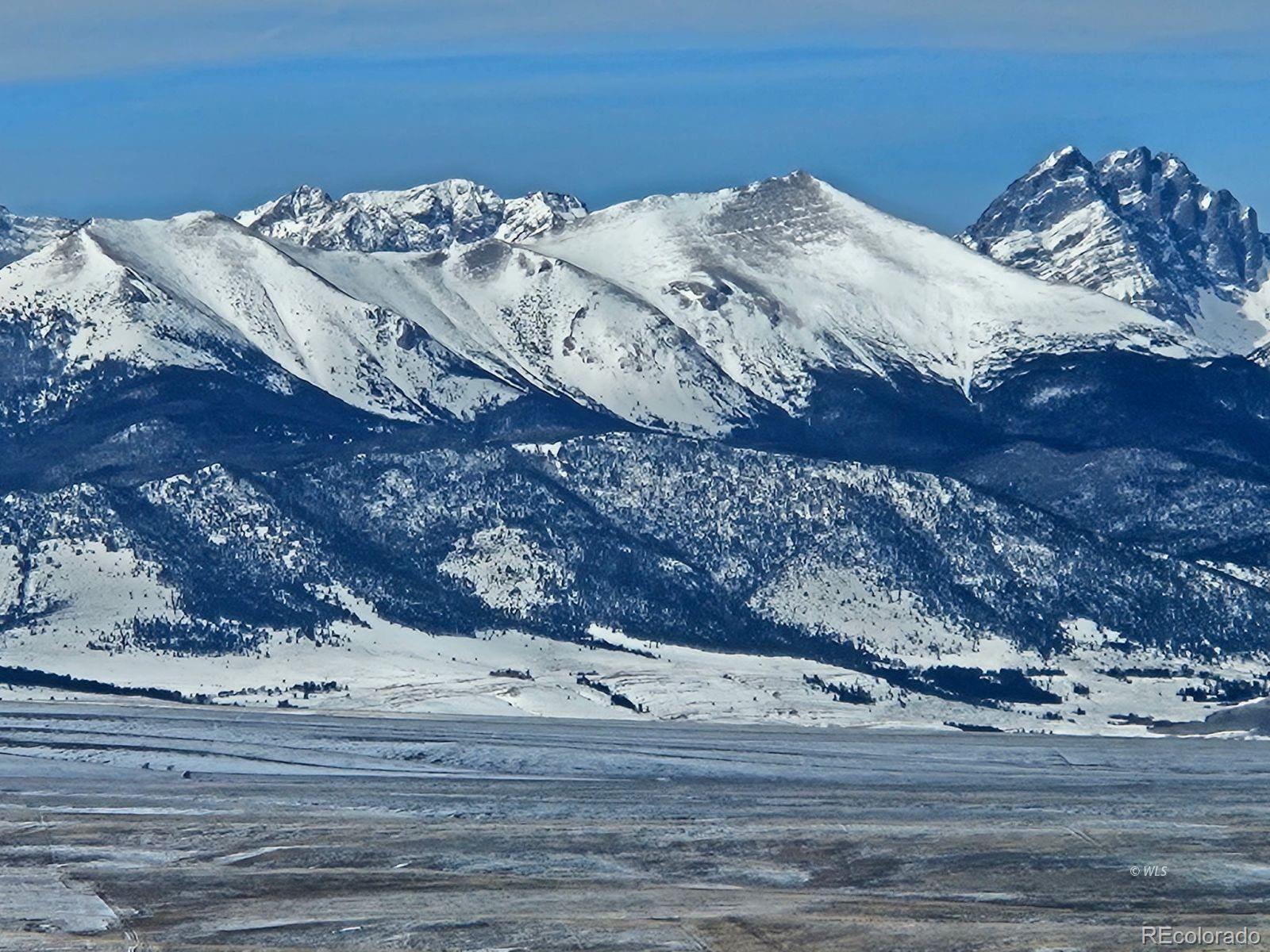 535 Brittany Road Westcliffe, CO 81252 - Photo 31 of 31 a bed sitting in a bedroom next to a bed