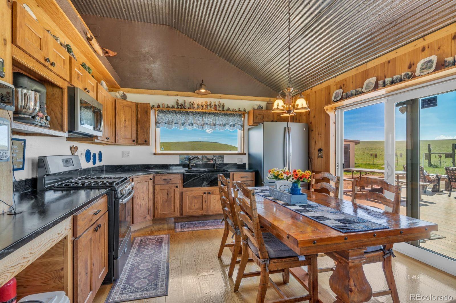 535 Brittany Road Westcliffe, CO 81252 - Photo 4 of 31 a outdoor dining space with a table and chairs