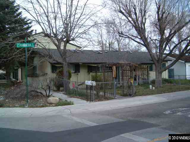 1290 Manhattan Street Reno, NV 89512 - Photo 1 of 9 a front view of a house with garden and porch
