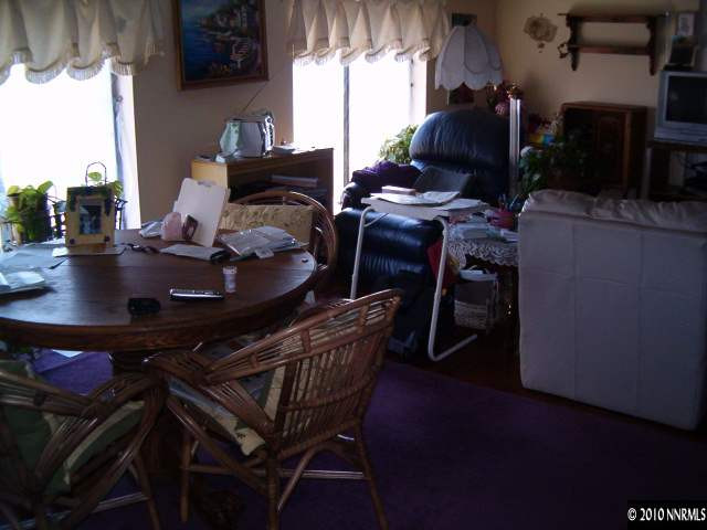 1290 Manhattan Street Reno, NV 89512 - Photo 8 of 9 a view of a dining room with furniture and chandelier