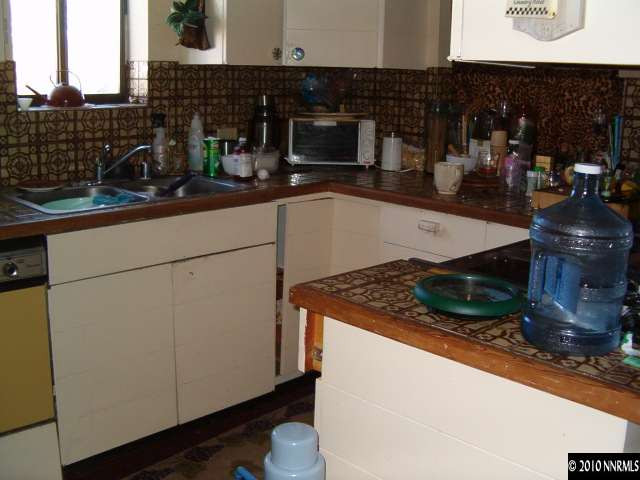 1290 Manhattan Street Reno, NV 89512 - Photo 9 of 9 a kitchen with a sink and cabinets