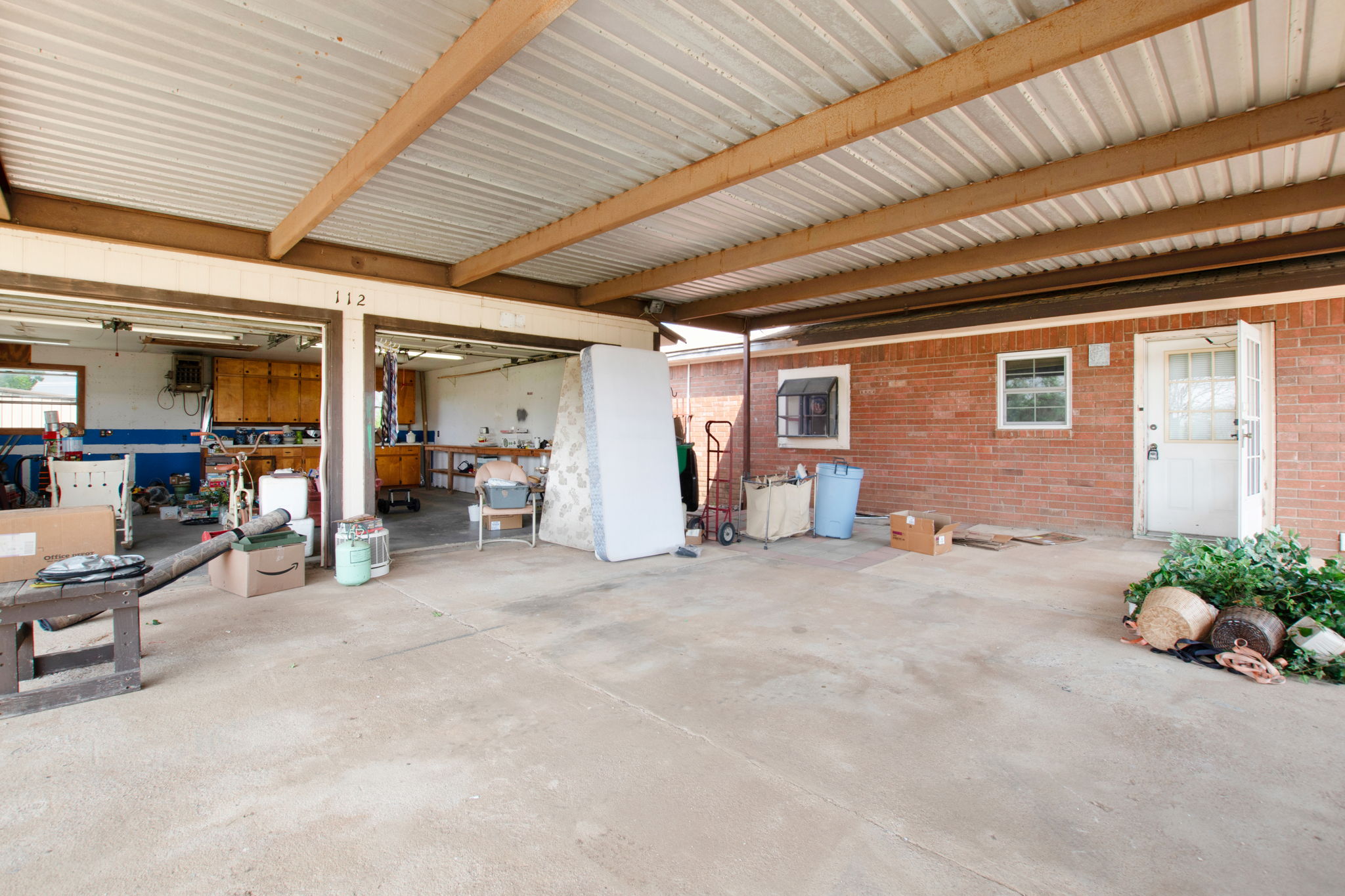 112 Frazier Tow, TX 78672 - Photo 21 of 30 Garage featuring metal wall
