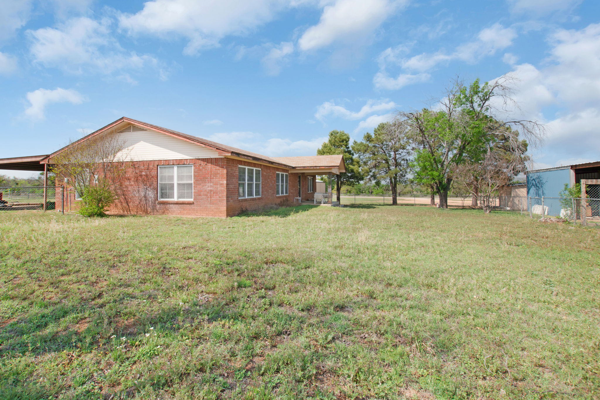 112 Frazier Tow, TX 78672 - Photo 4 of 30 View of yard featuring a carport and fence