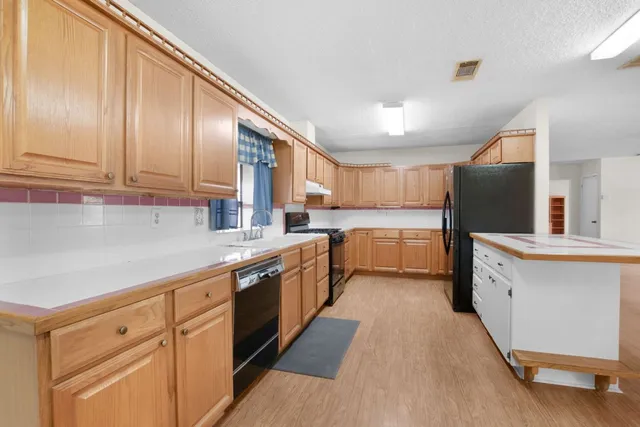 a large kitchen with cabinets