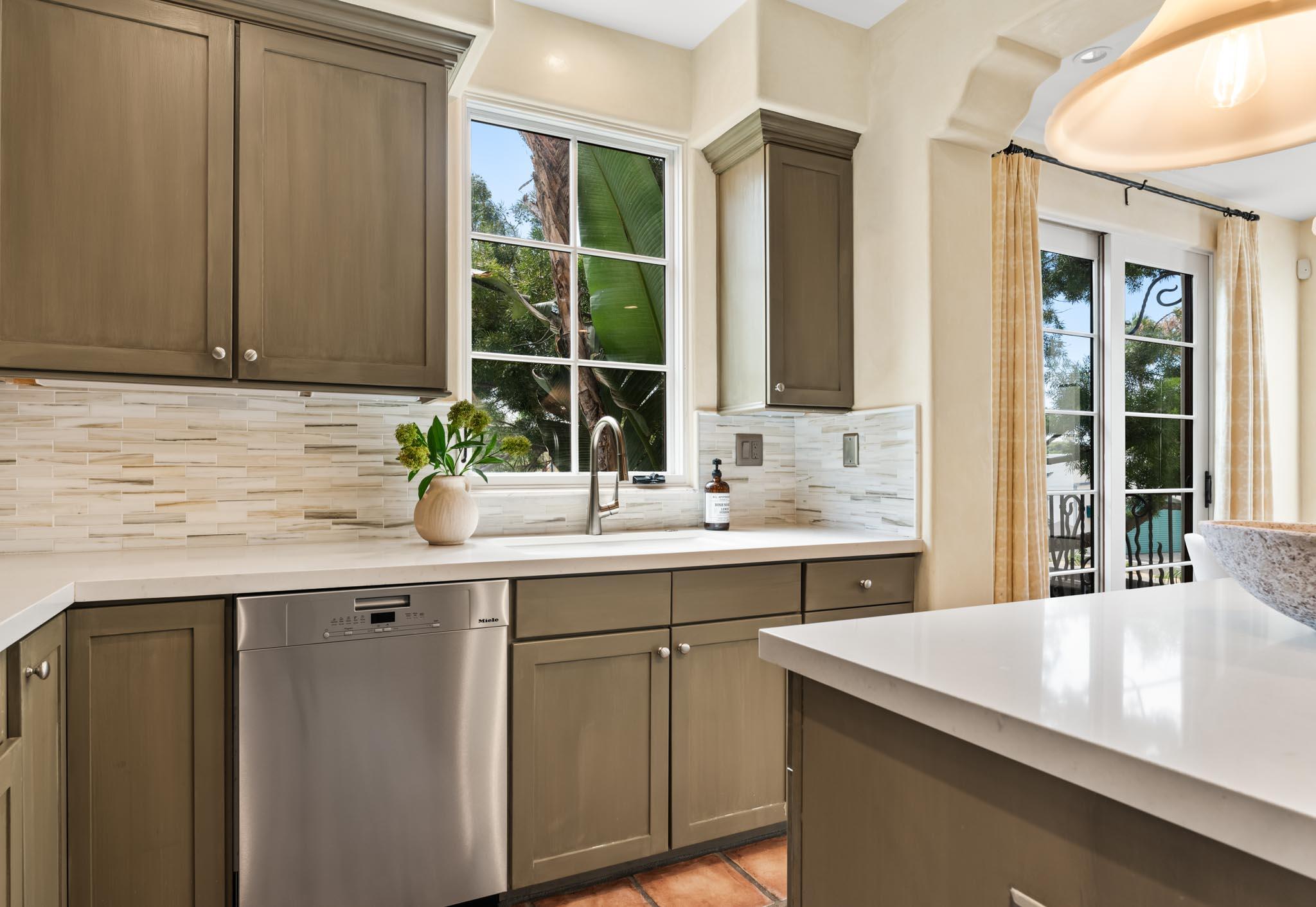 212 Santa Barbara Street, Unit B Santa Barbara, CA 93101 - Photo 12 of 28 a kitchen with a sink and cabinets