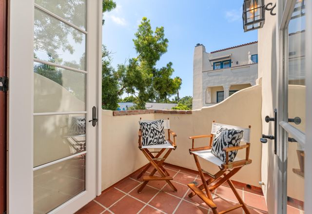 a view of a hallway with seating area