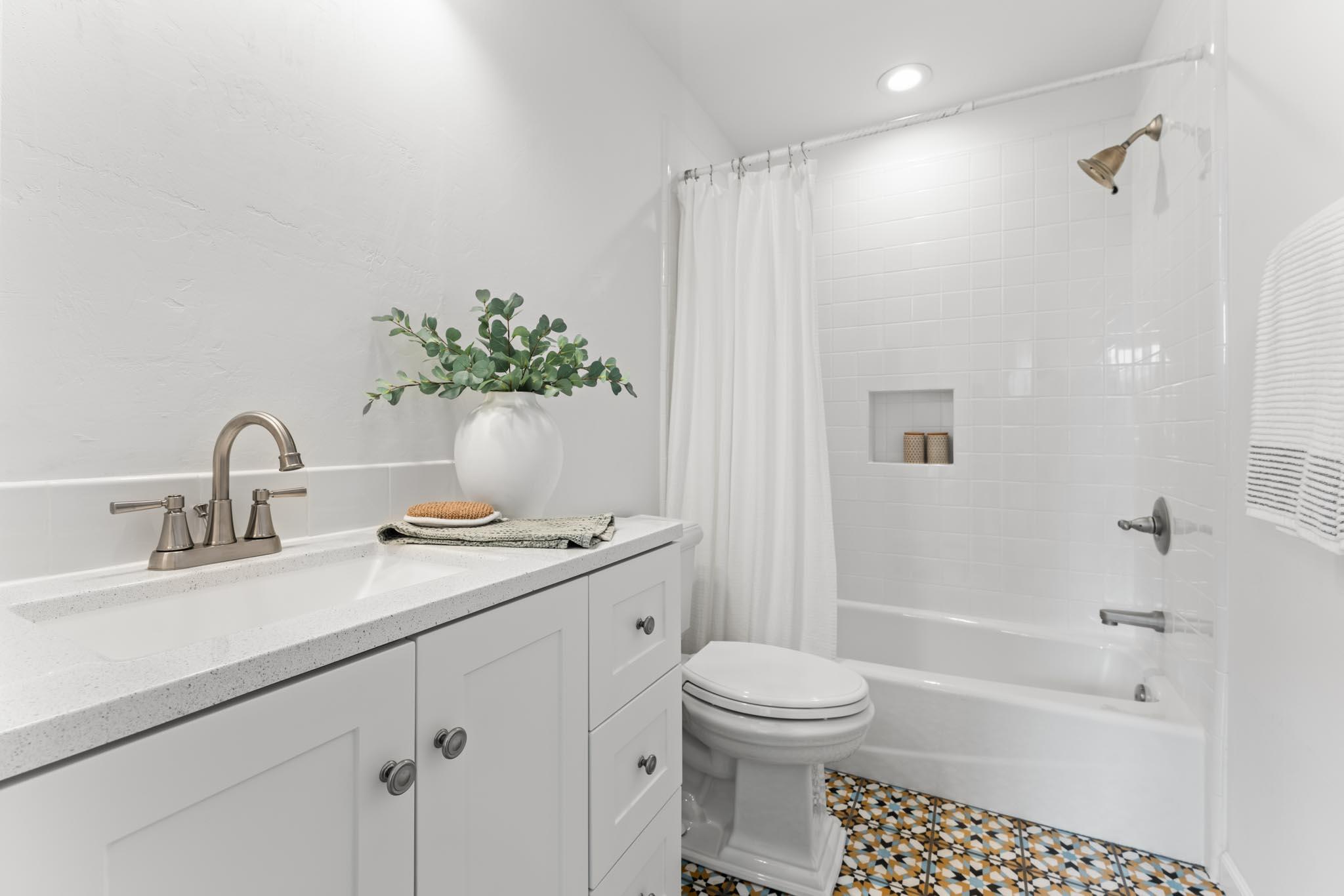 212 Santa Barbara Street, Unit B Santa Barbara, CA 93101 - Photo 19 of 28 a bathroom with a sink a toilet and shower