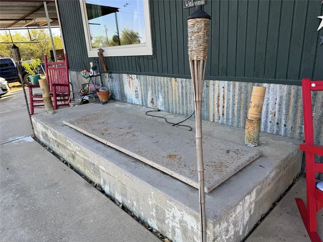 a view of a hallway with seating space