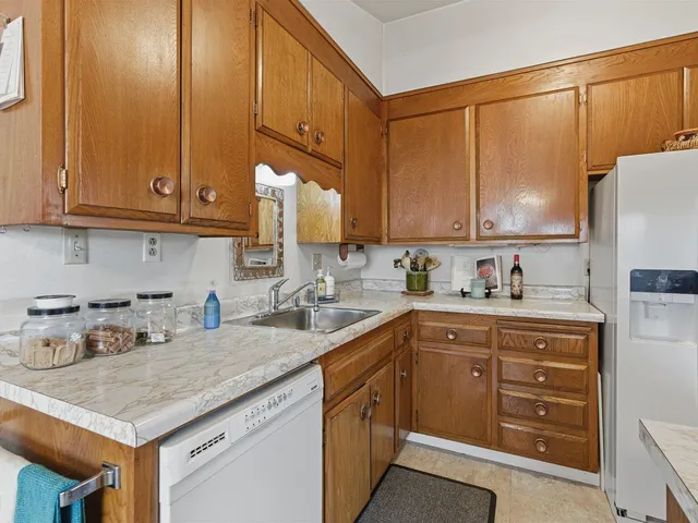 a bedroom with a bed and a dresser in it