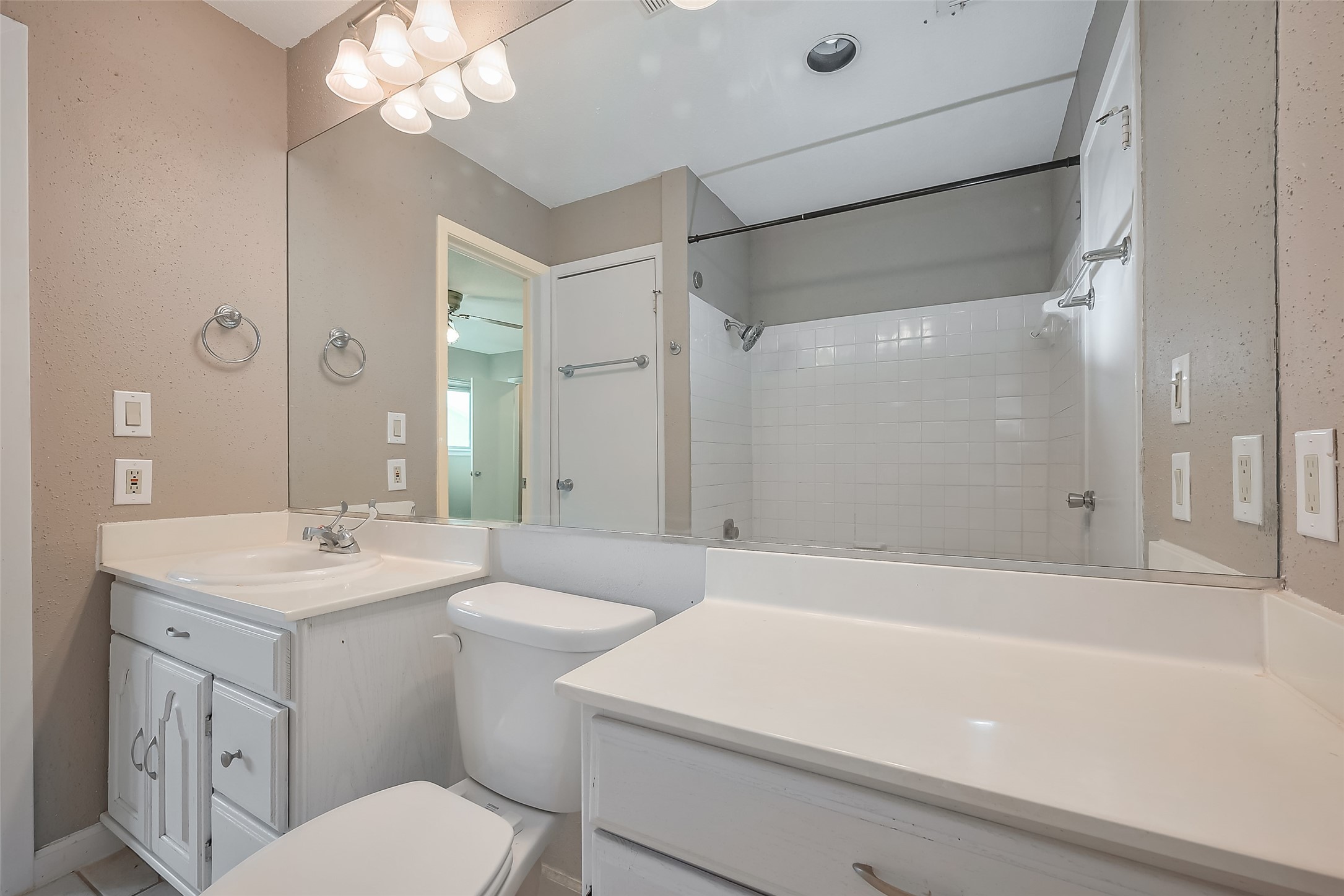 6111 Beverly Hill Street, Unit 29 Houston, TX 77057 - Photo 15 of 22 a bathroom with a sink a toilet a mirror and shower