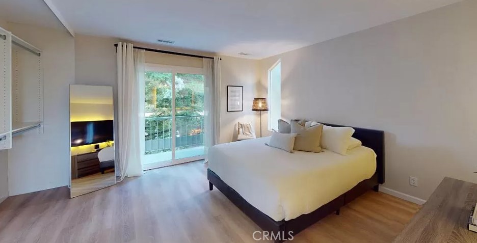 96 Anchorage Road Sausalito, CA 94965 - Photo 7 of 12 a bedroom with a bed and a large window