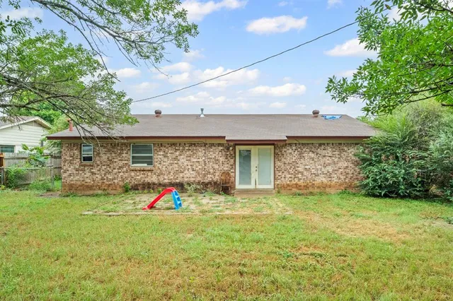 a backyard of a house with portable swimming pool and outdoor seating