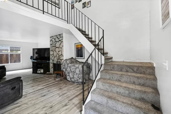 a kitchen with stainless steel appliances a stove top oven a sink dishwasher and a refrigerator