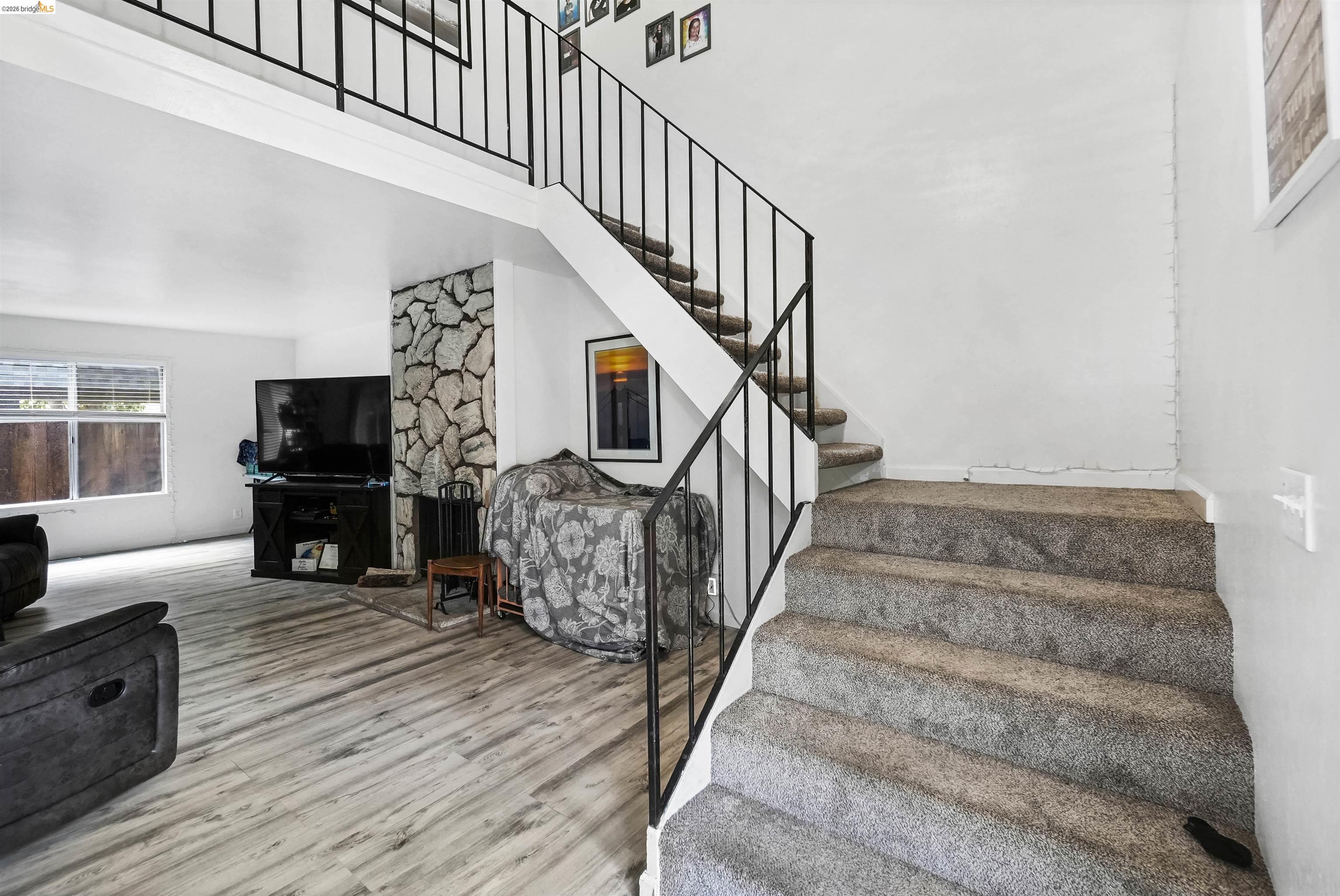 1066 San Miguel Road Concord, CA 94518 - Photo 13 of 59 Stairs with wood finished floors and a high ceiling